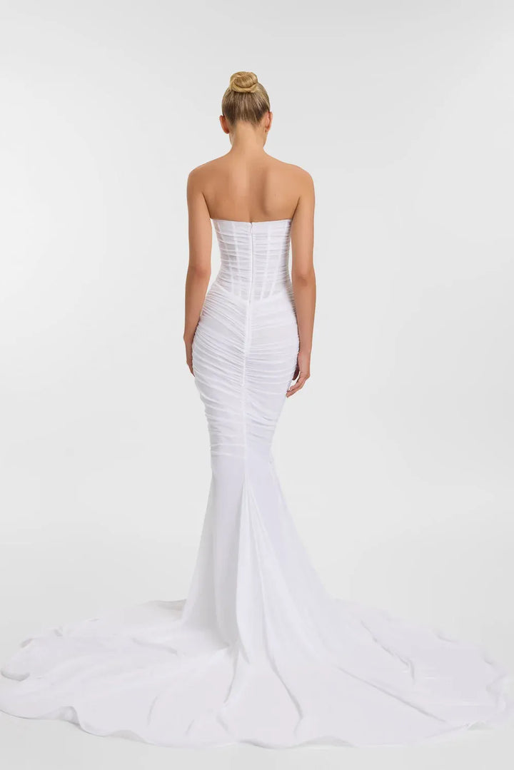full back of kyha blanc ivory mesh fitted wedding dress with a basque waist and strapless bodice