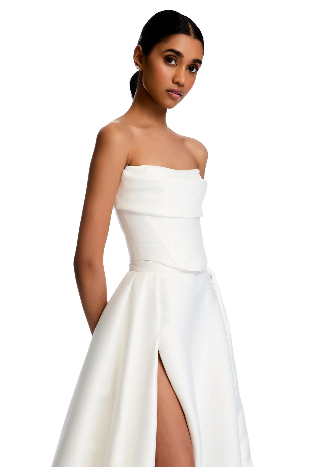 close up of kyha kasia corset and matching milford skirt set. bodice has a strapless neckline, and skirt has a high slit