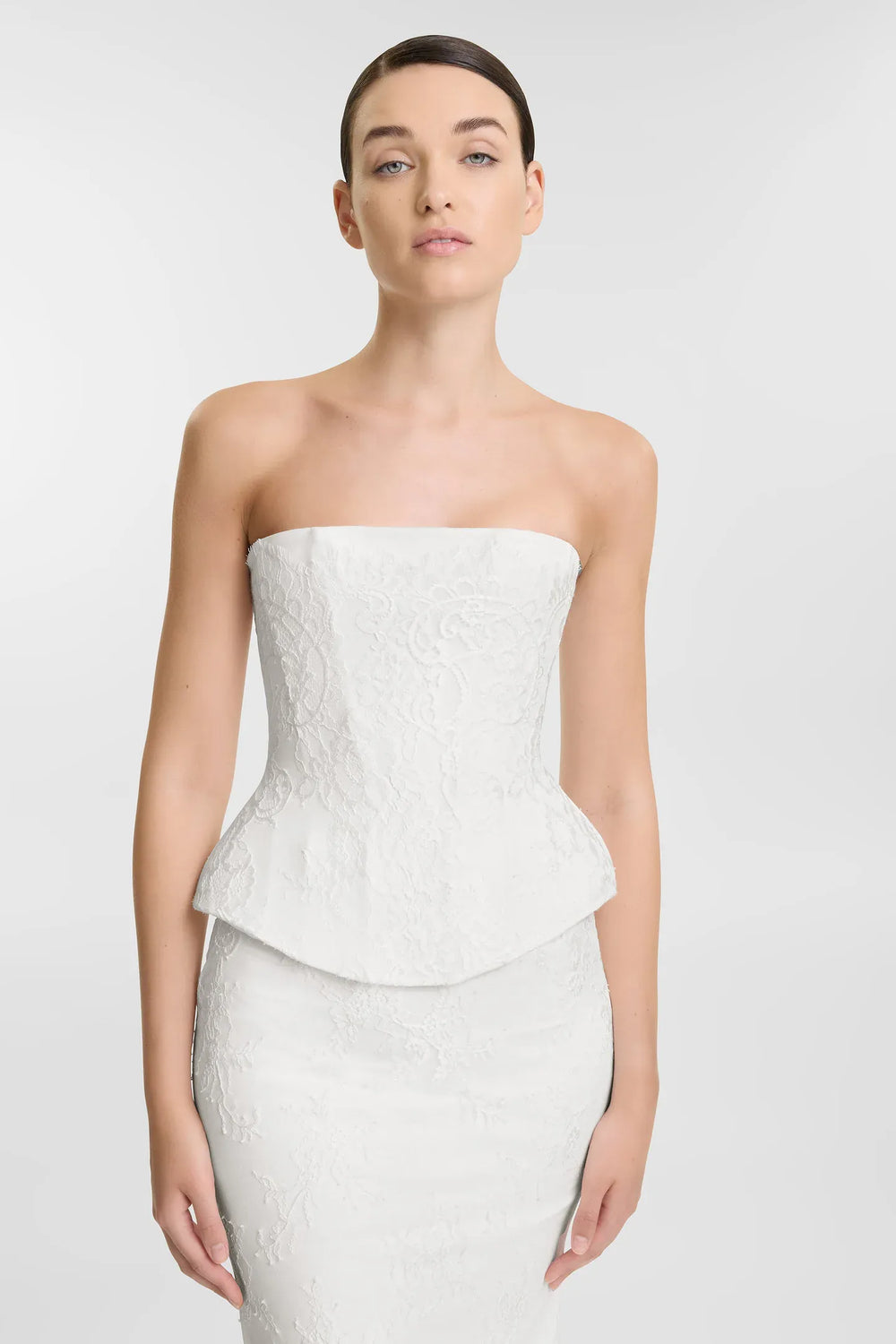  close up of kyha october corset and clover skirt with ivory lace and a strapless top