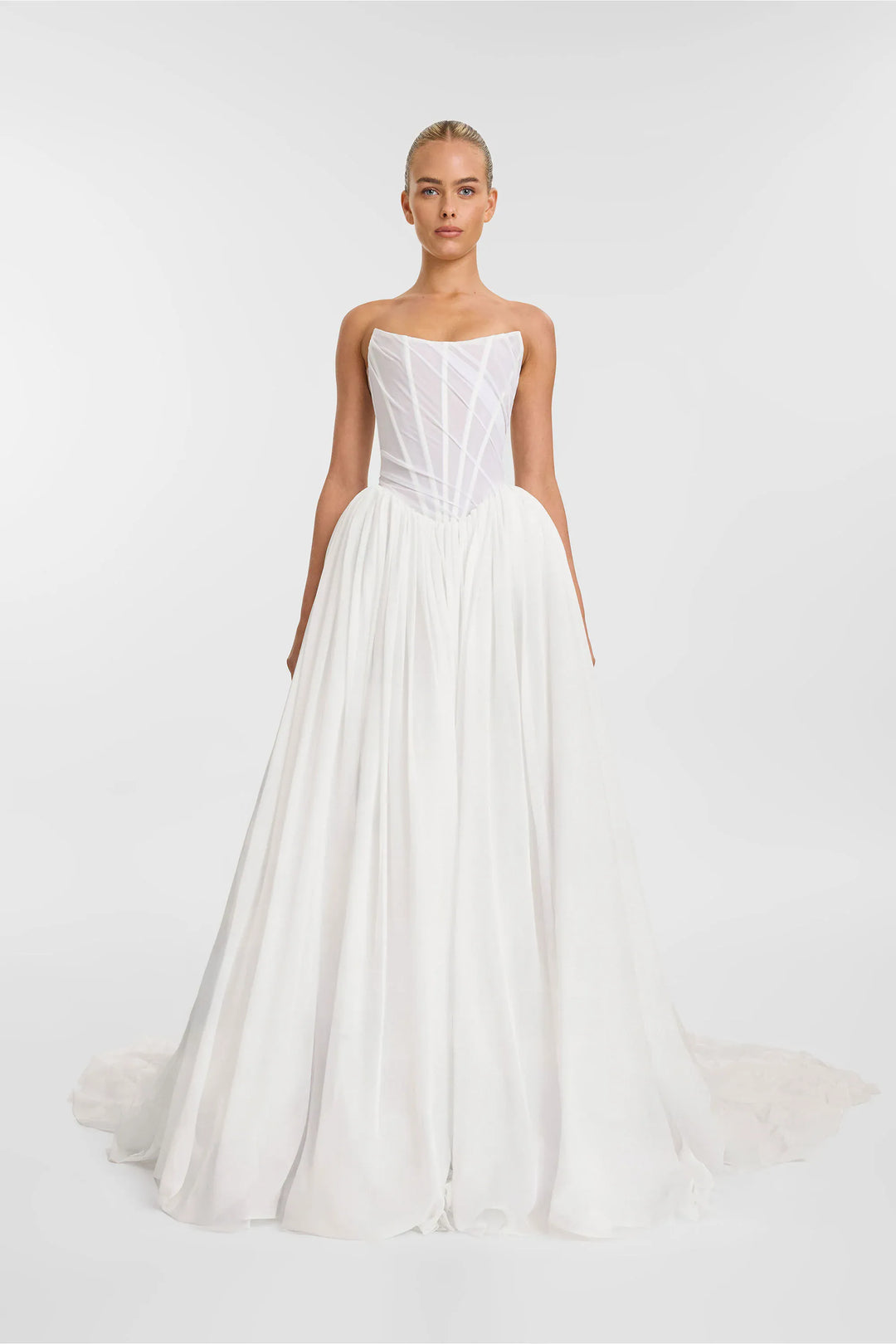 White strapless wedding dress on a white background