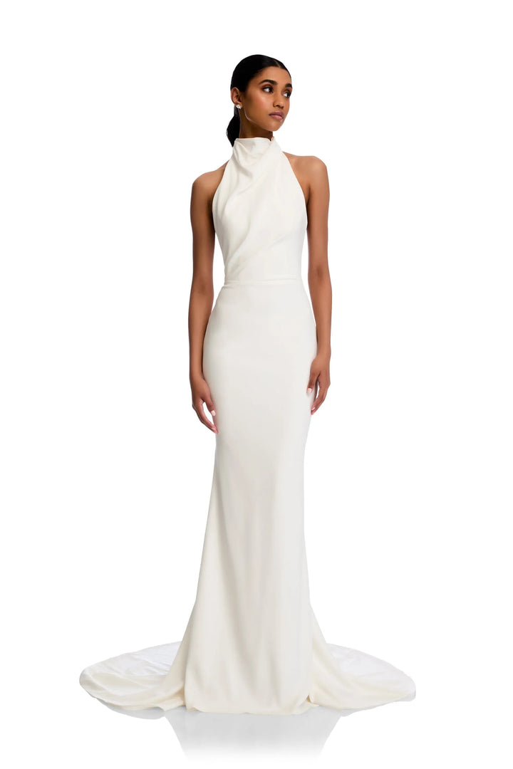 Woman wearing a white evening gown on a white background
