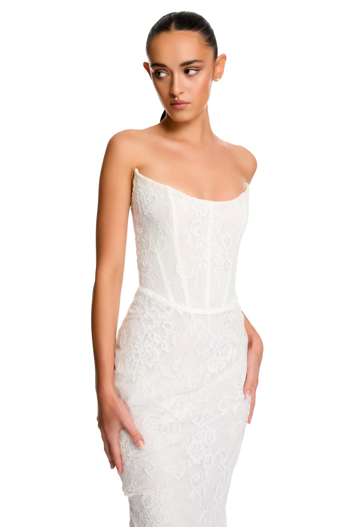 close up of kyha torrens lace fitted ivory wedding dress with a strapless scoop neckline