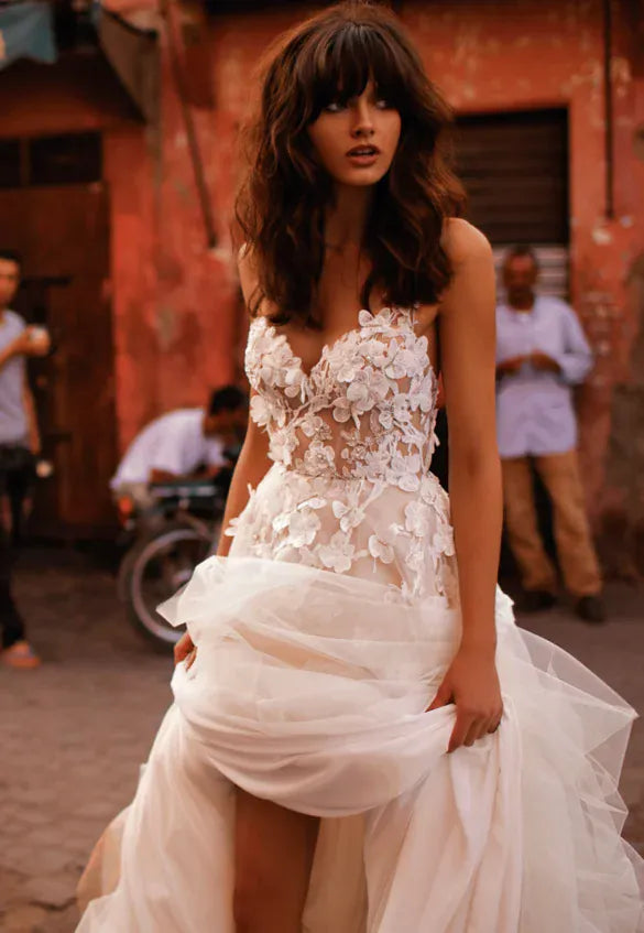 close up of liz martinez collette blush tulle a-line wedding dress wit lace appliques and beading