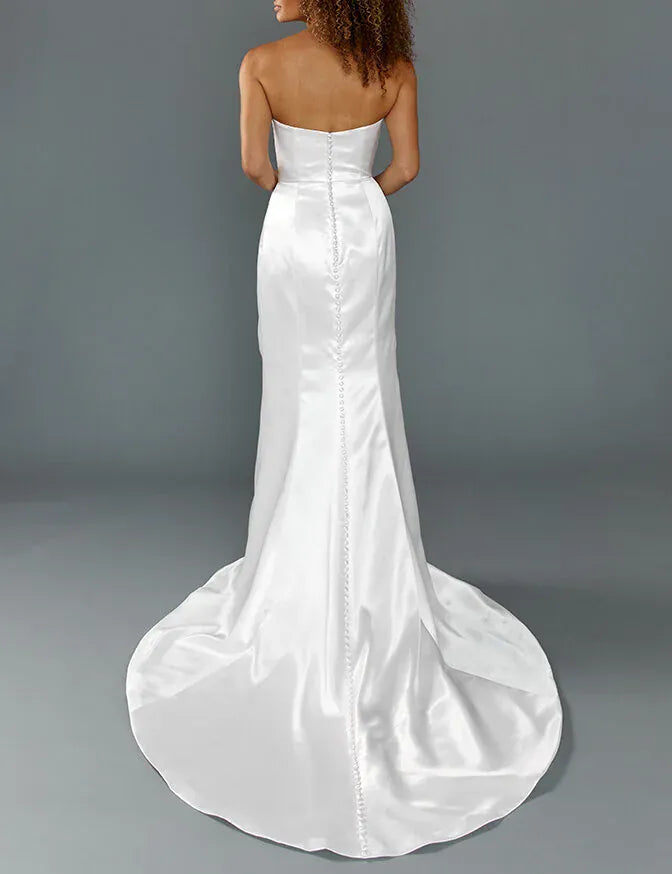 full back of louvienne cruz satin ivory fitted wedding dress with a strapless bodice and chapel length train