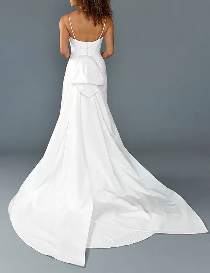full back of louvienne rhys ivory crepe fitted wedding dress with an added train piece with a bow