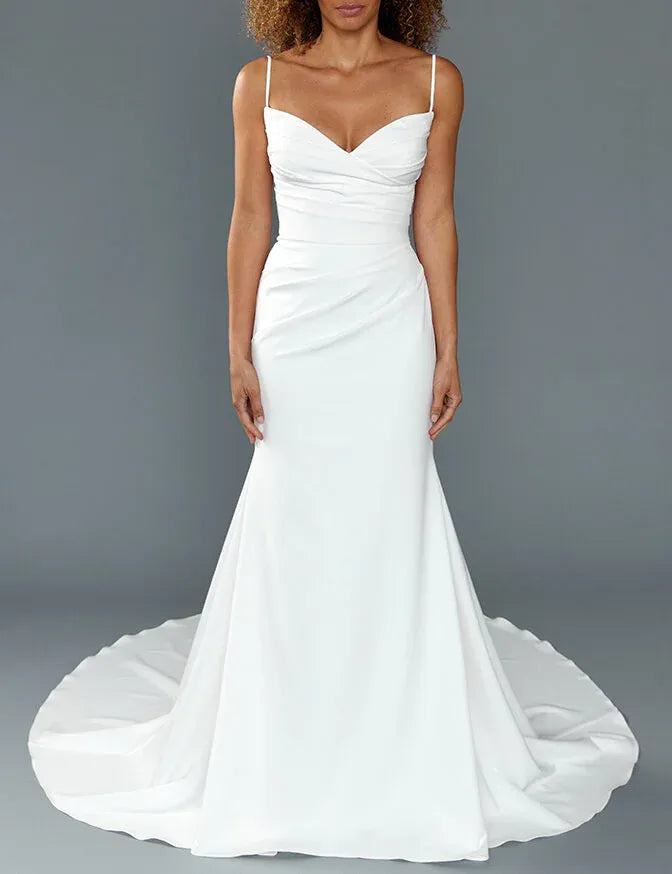 front of louvienne rocky crepe ivory fitted wedding dress with a ruched bodice and v neckline