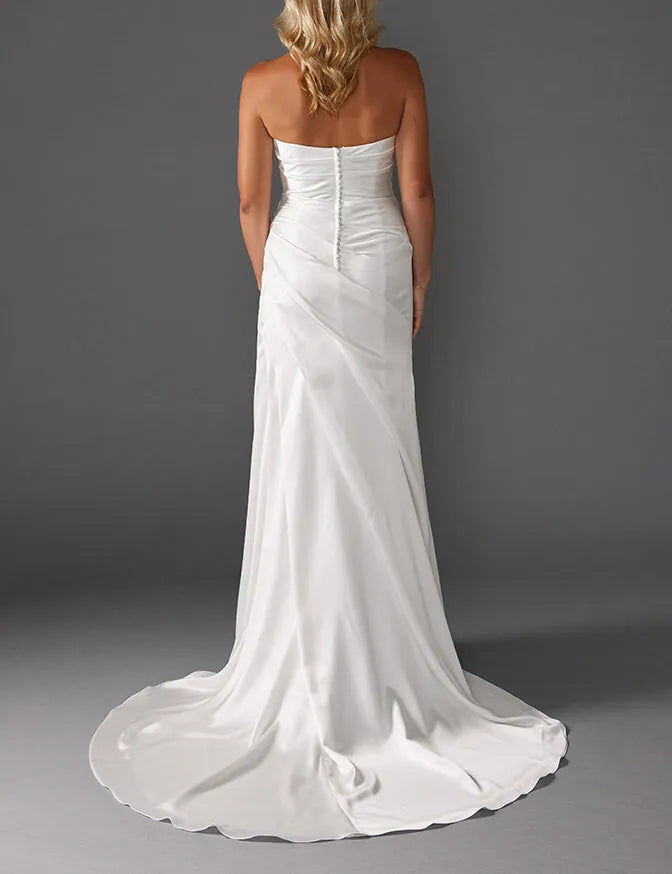 full back of louvienne shay ivory charmeuse sheath wedding dress with a strapless bodice and short train