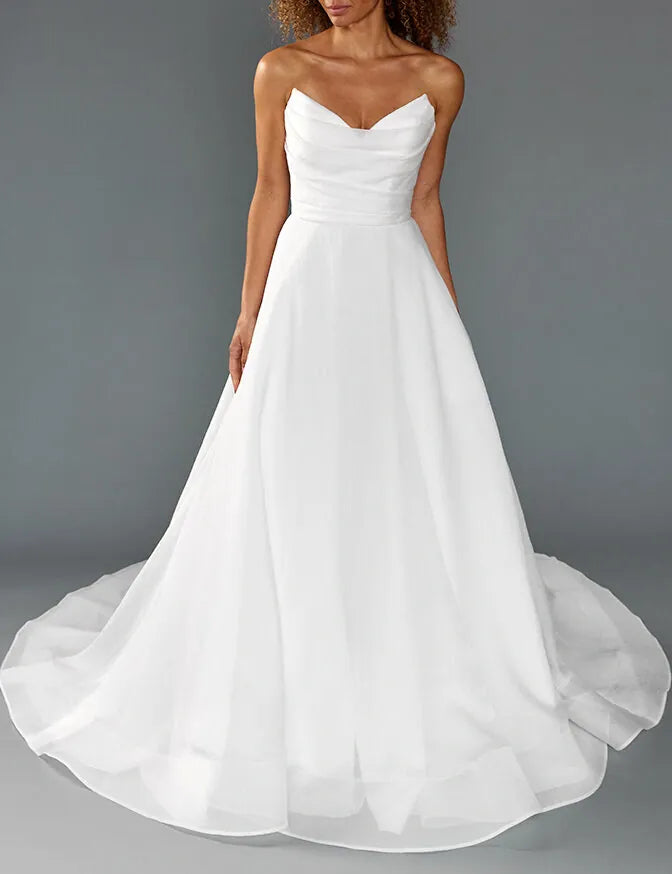 front of louvienne sutton ivory organdy a-line wedding dress with pointed v neckline and strapless bodice