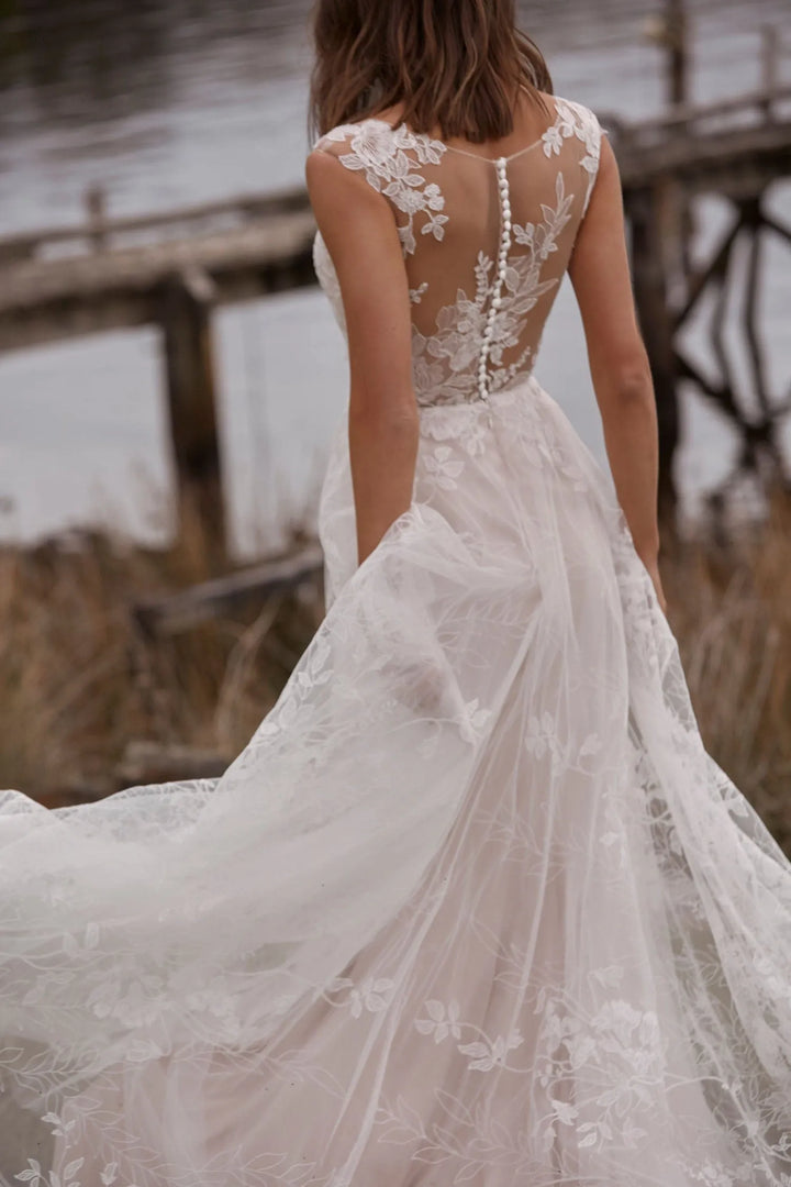 close up of the back of madi lane camille ivory lace a-line wedding dress with a sheer back