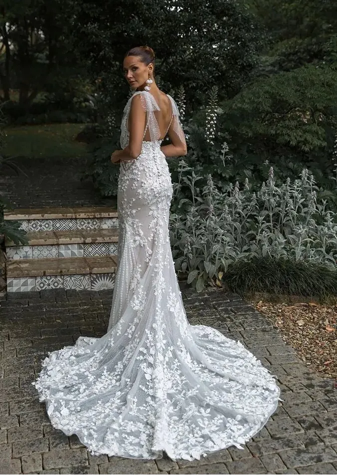full back of madi lane ml23575 nude tulle fitted wedding dress with lace accents and shimmer tulle bows at the shoulders, with a short train