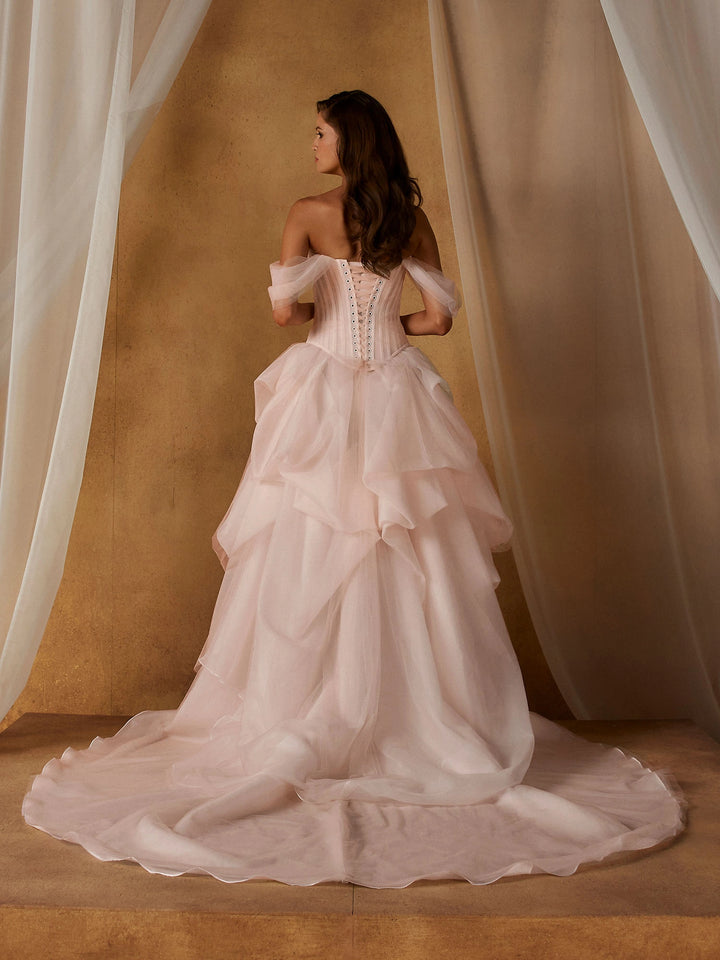 back of madi lane nickel and novella set. the nickel bodice has a lace up back, and the novella skirt has a short circle train