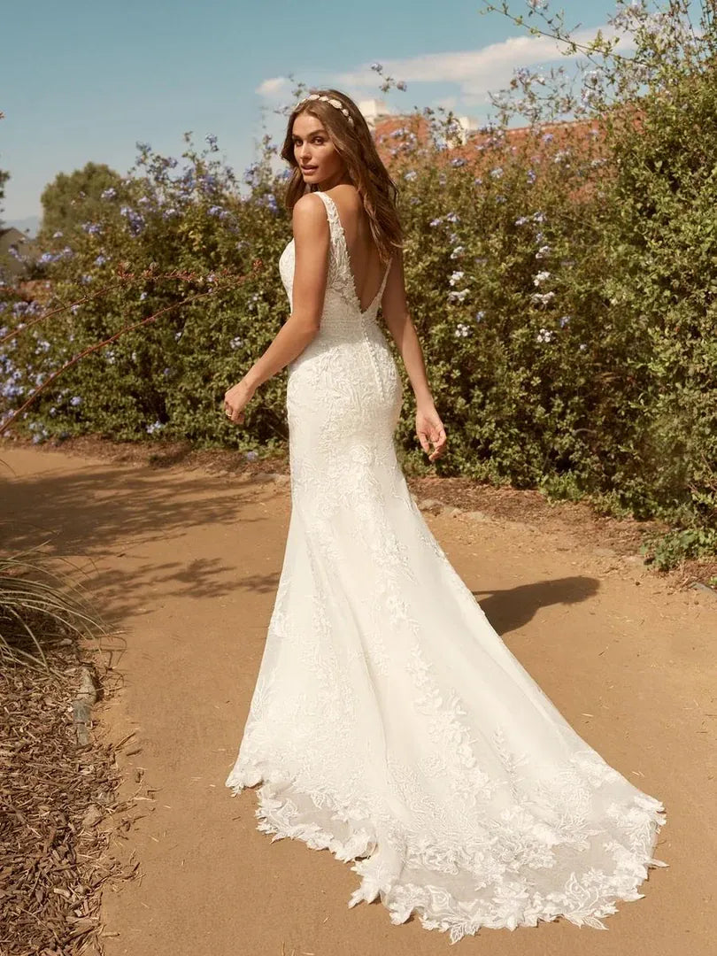 back of maggie sottero albany ivory lace fitted wedding dress with open back and chapel length train trimmed with lace appliques
