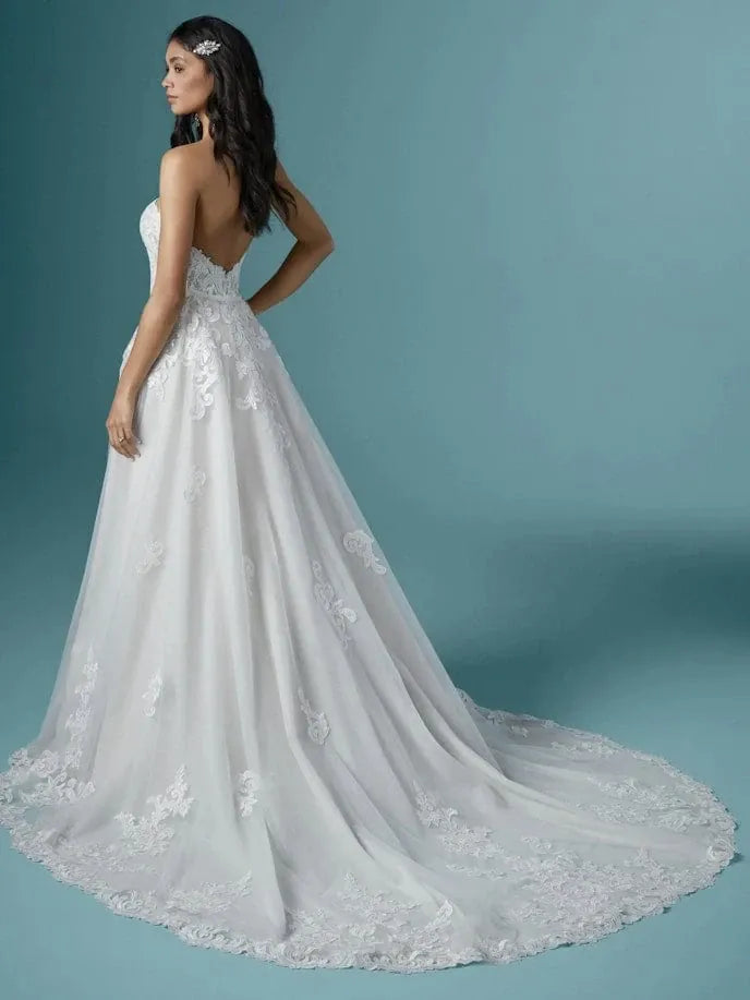 back of maggie sottero kaysen lace fitted wedding dress with matching overskirt