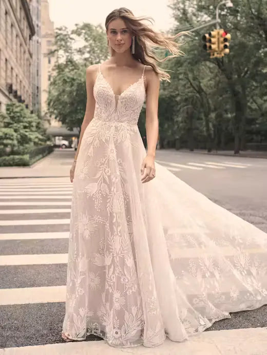 full front of maggie sottero keisha blush lace a-line wedding dress with a deep v neckline and thin straps