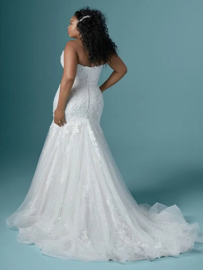 full back of maggie sottero lonnie lynette ivory lace fit ad flare wedding dress showing the strapless bodice + frothy train