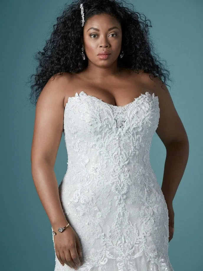 close up of maggie sottero lonnie lynette ivory lace fit ad flare wedding dress showing the strapless sweetheart bodice