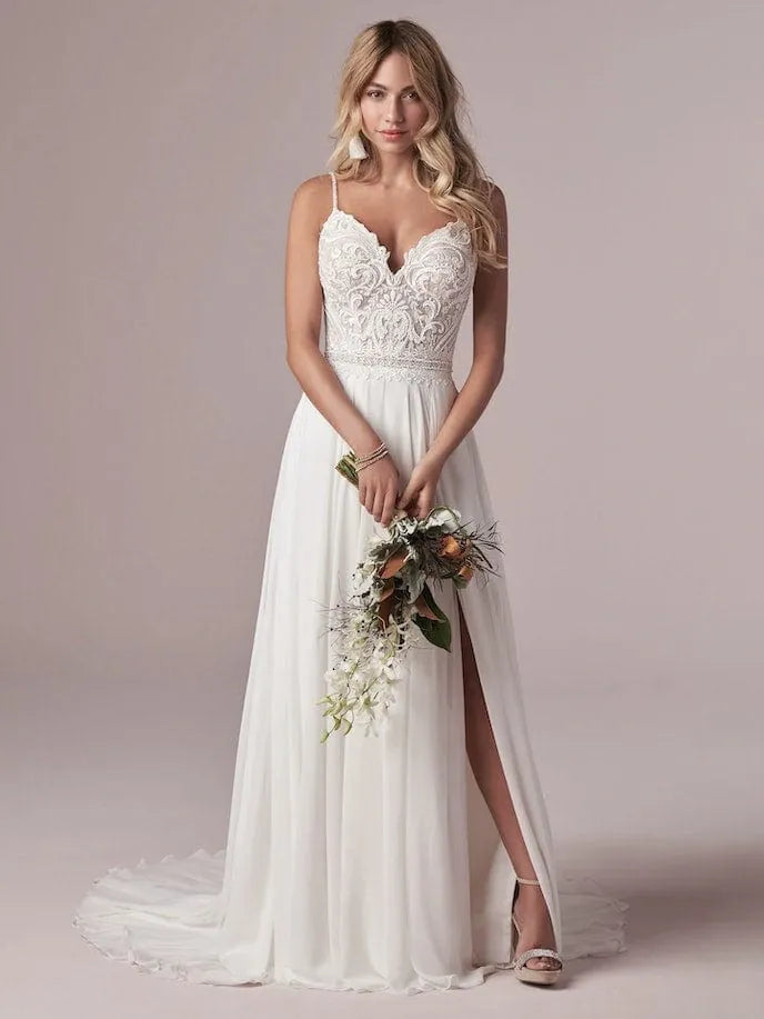 full front of maggie sottero lorraine ivory chiffon a-line wedding dress featuring a lace bodice with thin straps, and a slit in the skirt