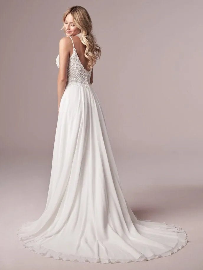 full back of maggie sottero lorraine ivory chiffon a-line wedding dress featuring a lace bodice with thin straps, and a short train