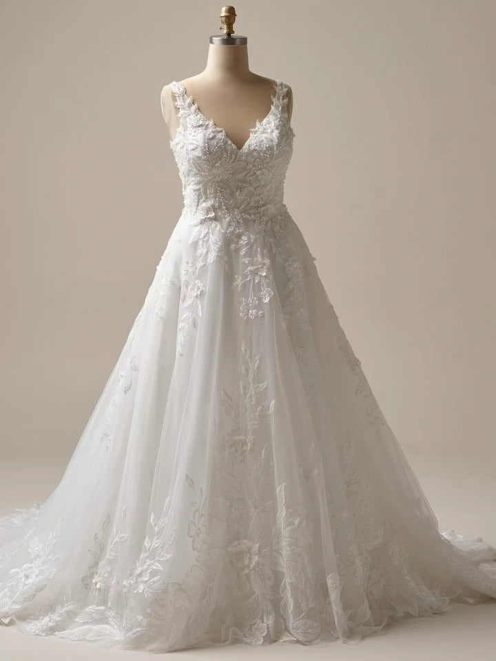 full front of maggie sottero magnolia ivory tulle a-line wedding dress with scattered lace appliques and a v neck bodice