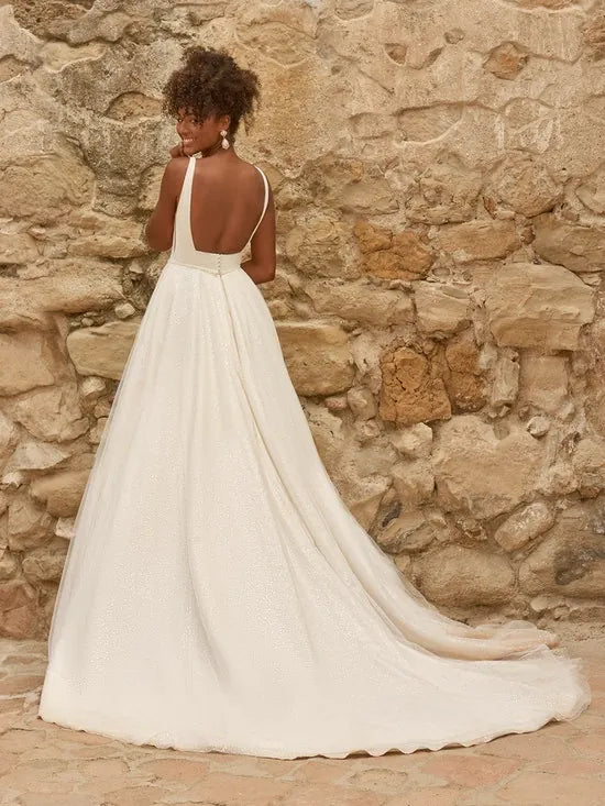 full back of maggie sottero symphony ivory tulle ball gown featuring a square back with a short train