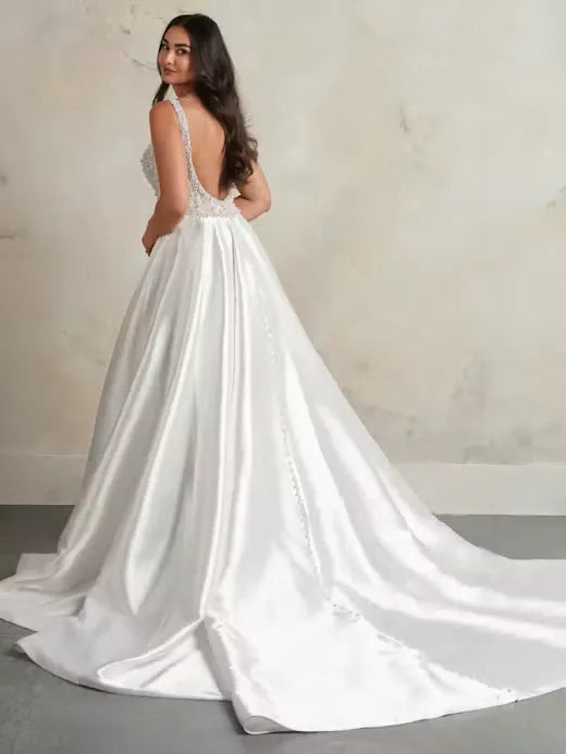 full back of maggie sottero zacasha ivory mikado a-line wedding dress with a beaded bodice and chapel length train