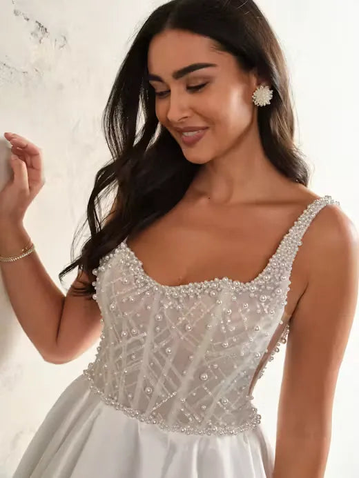 close up of maggie sottero zacasha ivory mikado a-line wedding dress with a beaded bodice