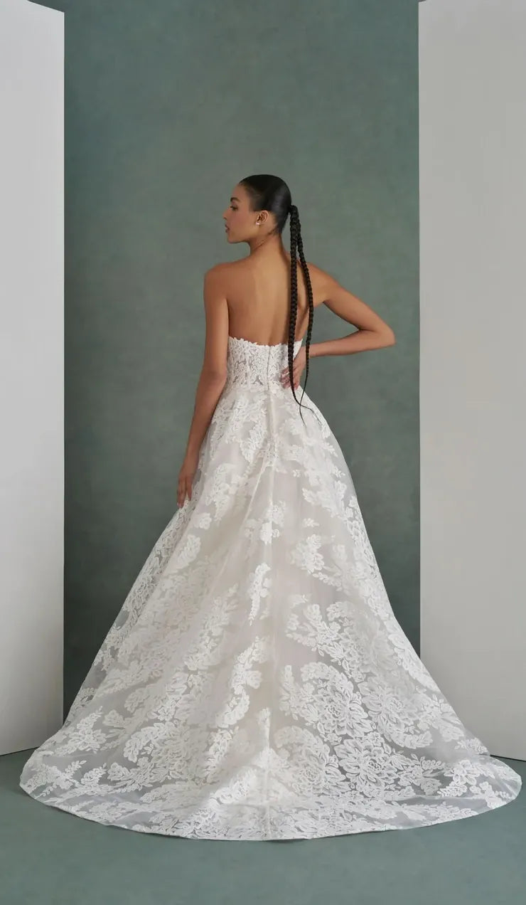 back of mark ingram cecilia ivory lace a-line wedding dress with an intricate print and short train