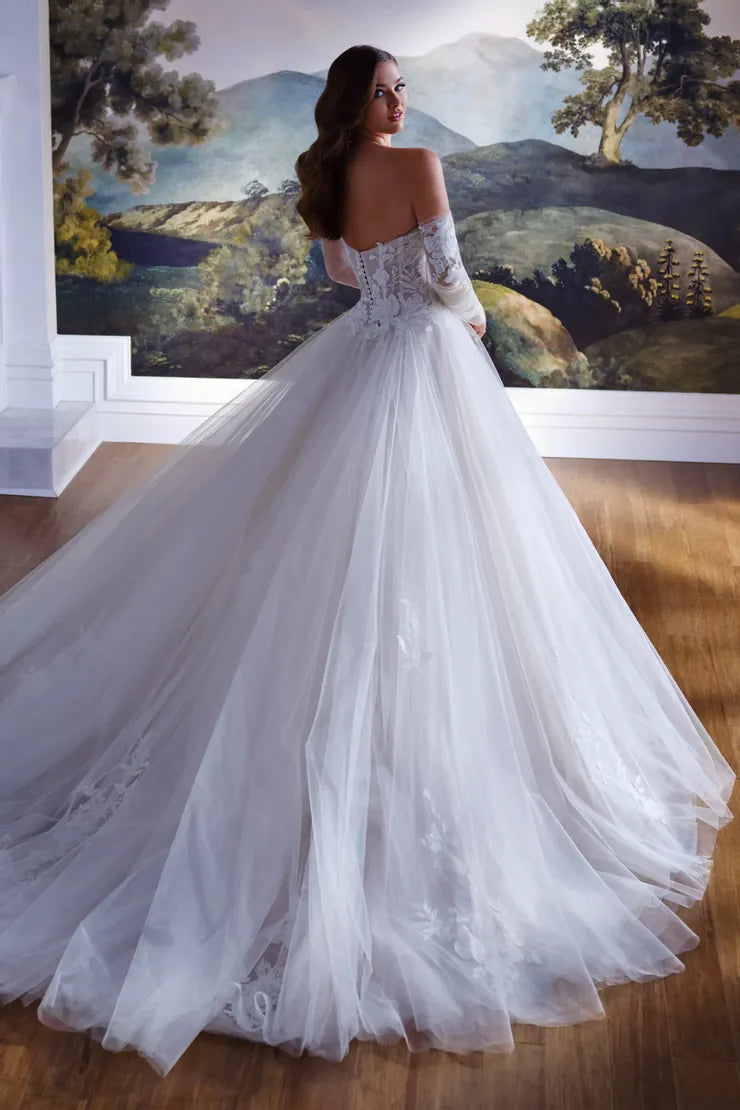 back of martin thornburg mt8108 champagne tulle ball gown wedding dress with cascading appliques + wispy chapel length train