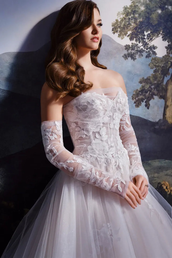 close up of martin thornburg mt8108 champagne tulle ball gown wedding dress showing the lace applique bodice