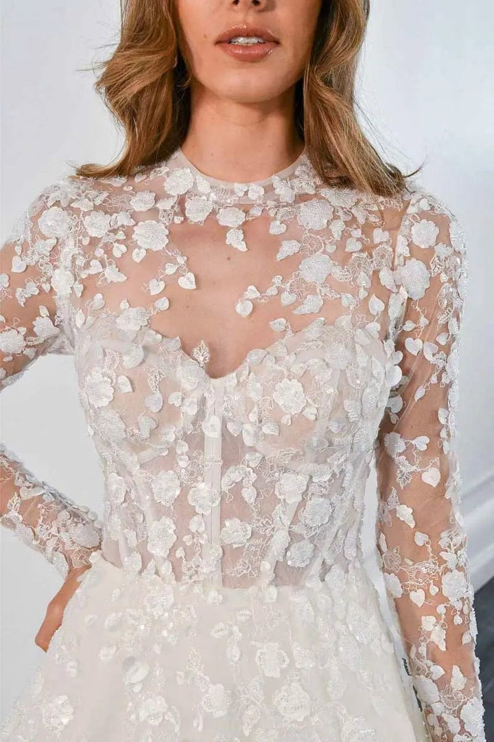 close up of martina liana ml1517 ivory lace ball gown showing the illusion neckline and long sheer sleeves
