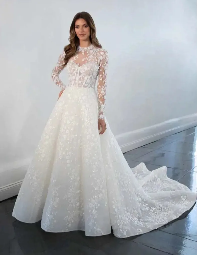 full front of martina liana ml1517 ivory lace ball gown with an illusion neckline and long leeves