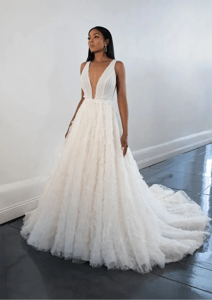 front of martina liana 1531 champagne tulle ball gown, showing the full front with plunge neckline and ruffled skirt