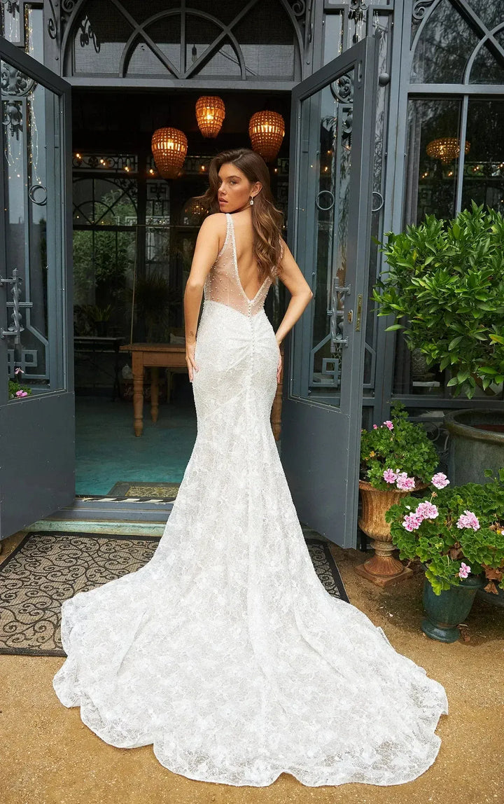 full back of martina liana 1697 ivory lace sheath wedding dress with a scoop neckline and thin straps, with a shaped train