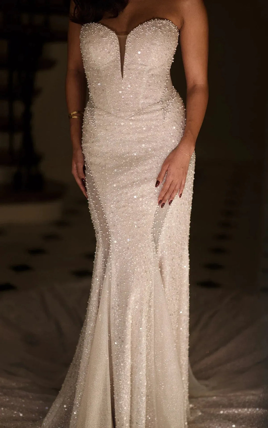 close up of martina liana 1751 ivory beading fit and flare wedding dress with a strapless sweetheart neckline