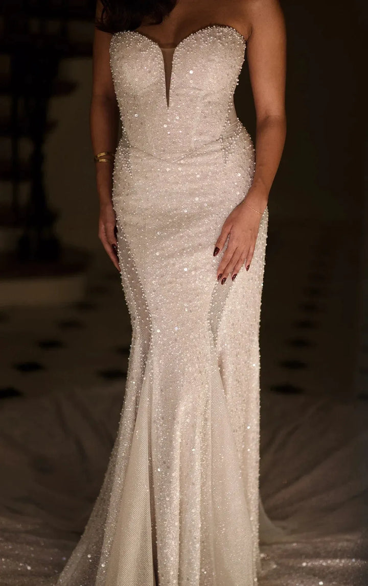 close up of martina liana 1751 ivory beading fit and flare wedding dress with a strapless sweetheart neckline