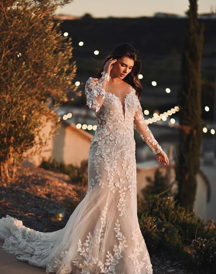 full front of martina liana ml1440 nude tulle fitted wedding dress covered in floral laces, with a deep neckline and long sleeves
