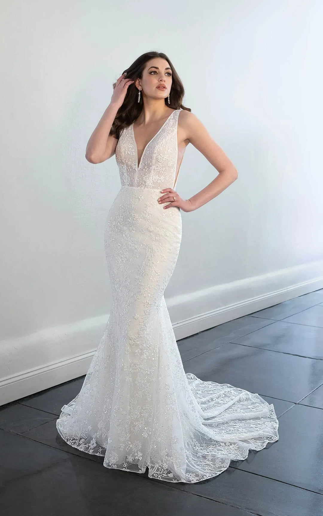 front of martina liana ml193 lace fitted wedding dress with a v neckline and thick straps, showing the deep cuts on the sides