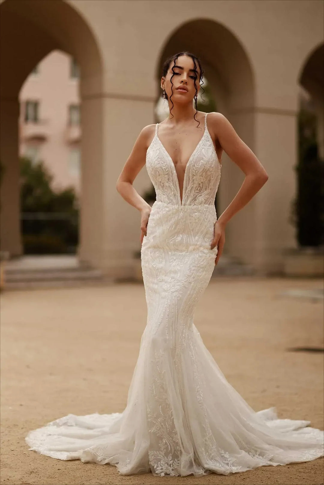 full front of martina liana ml1651 nude tulle fit and flare wedding dress with a plunging neckline and lace accents
