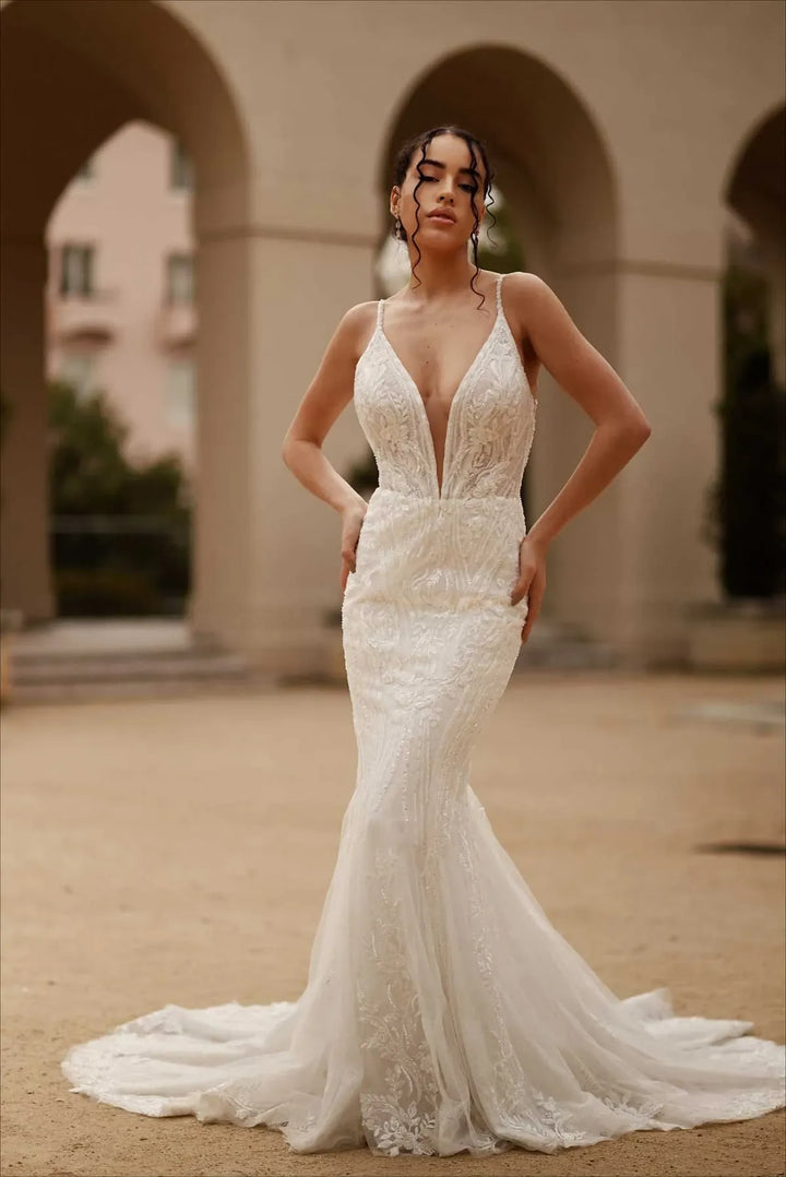 full front of martina liana ml1651 nude tulle fit and flare wedding dress with a plunging neckline and lace accents