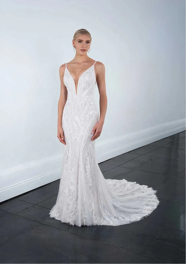 full front of martina liana ml1651 nude tulle fit and flare wedding dress with a plunging neckline and lace accents