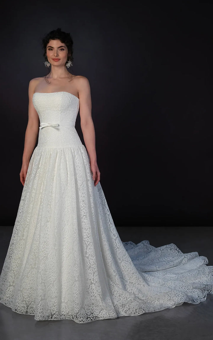 full front of martina liana ml1911 ivory lace drop waist wedding dress featuring a strapless bodice with a matching ivory ribbon belt