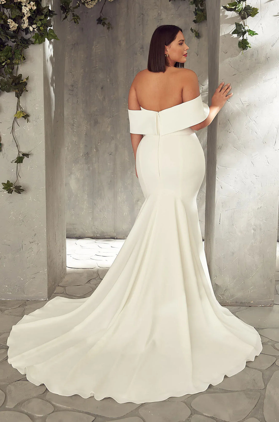 back of mikaella 2405 ivory crepe fitted wedding dress with an off the shoulder neckline and chapel length train