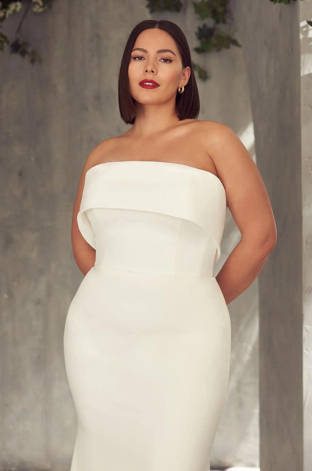 close up of mikaella 2405 ivory crepe fitted wedding dress with a strapless banded neckline