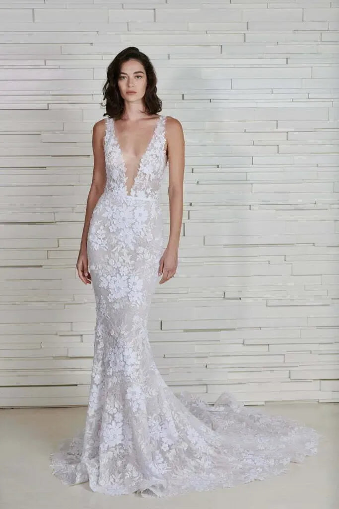 full front of mira zwillinger jona ivory lace fitted wedding dress with a deep v neckline