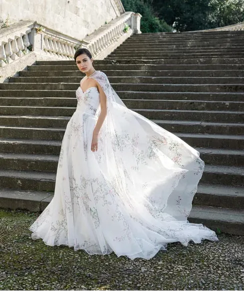 full front of monique lhuillier bl25105 printed organza wedding dress with matching floral cape