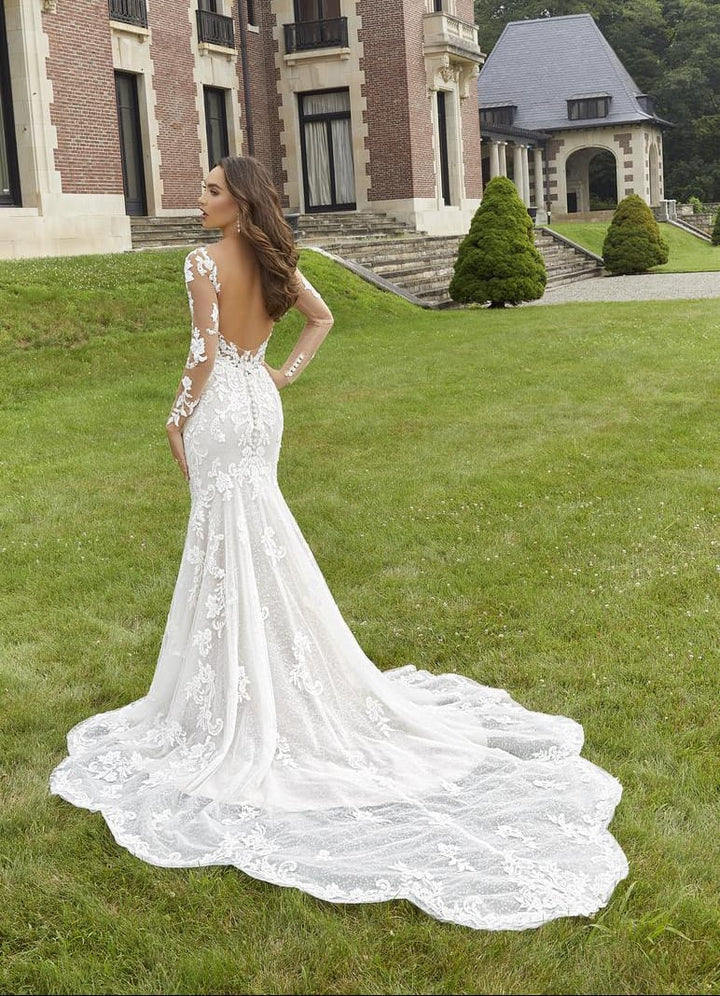 full back of morilee 2418 ivory lace fitted wedding dress with an open back and long sleeves