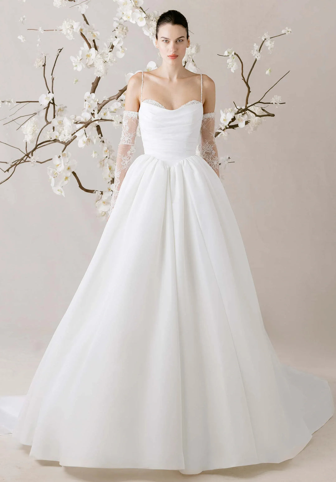 full front of morilee eleve ivory faille ball gown featuring the scoop neckline with ace underneath, thin straps, and a basque waist