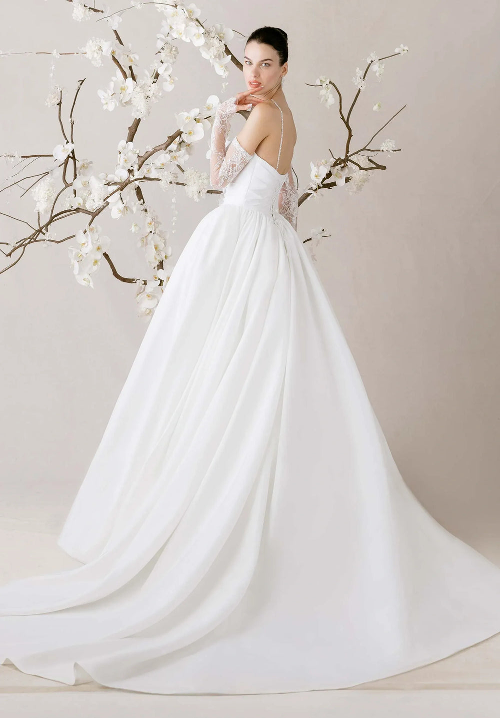 full back of morilee eleve ivory faille ball gown featuring the full skit and chapel length train