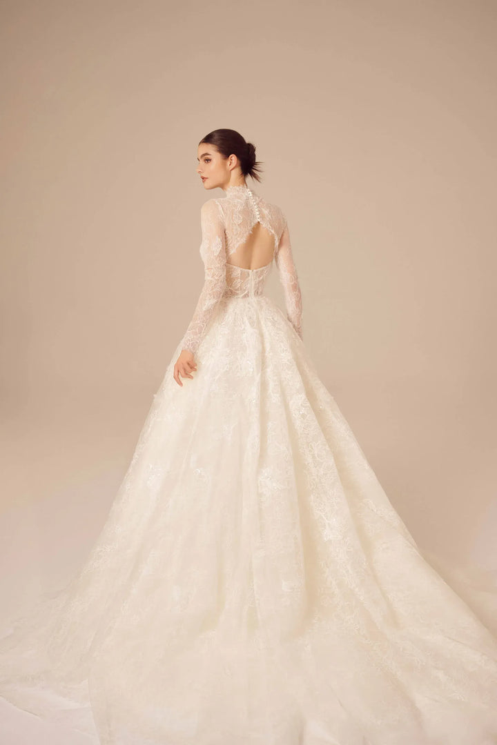 full back of nicole and felicia nf025 ivory lace ball gown wedding dress featuring an open back and long sleeve jacket, which is sold separately