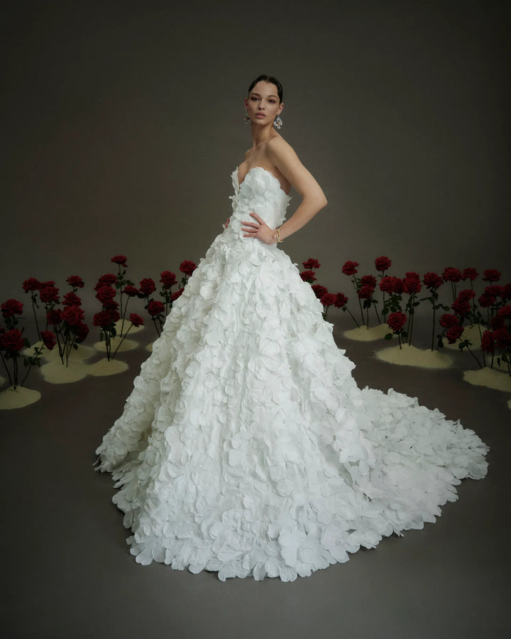 full front of nicole and felicia nf114 ivory organza ball gown with floral petals throughout